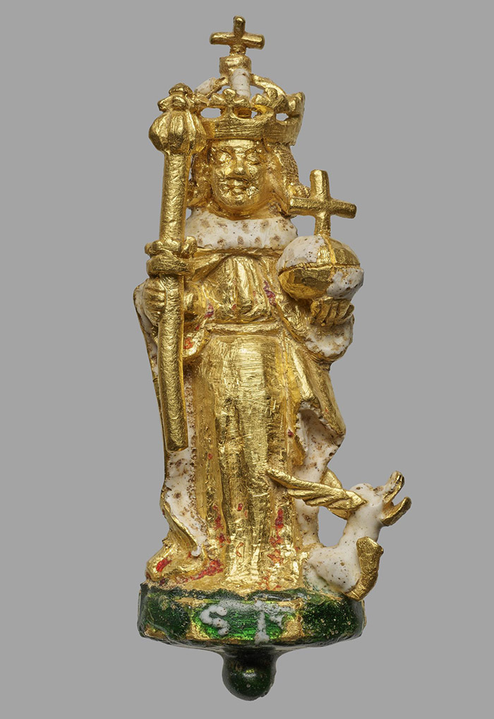 A gold figure of King Henry VI holding a sceptre and orb with a green enamelled base inscribed with the letters S.H.