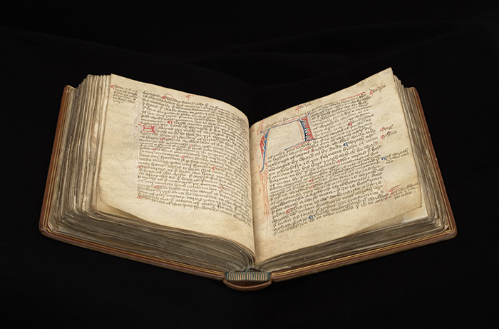 An open bound Medieval manuscript