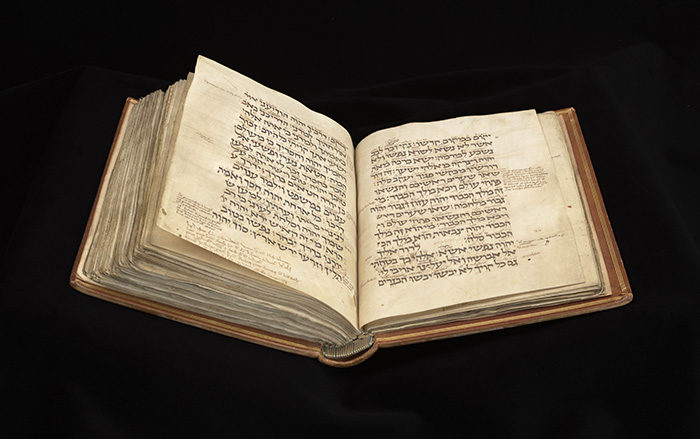 A bound Medieval manuscript open to a page with Hebrew text